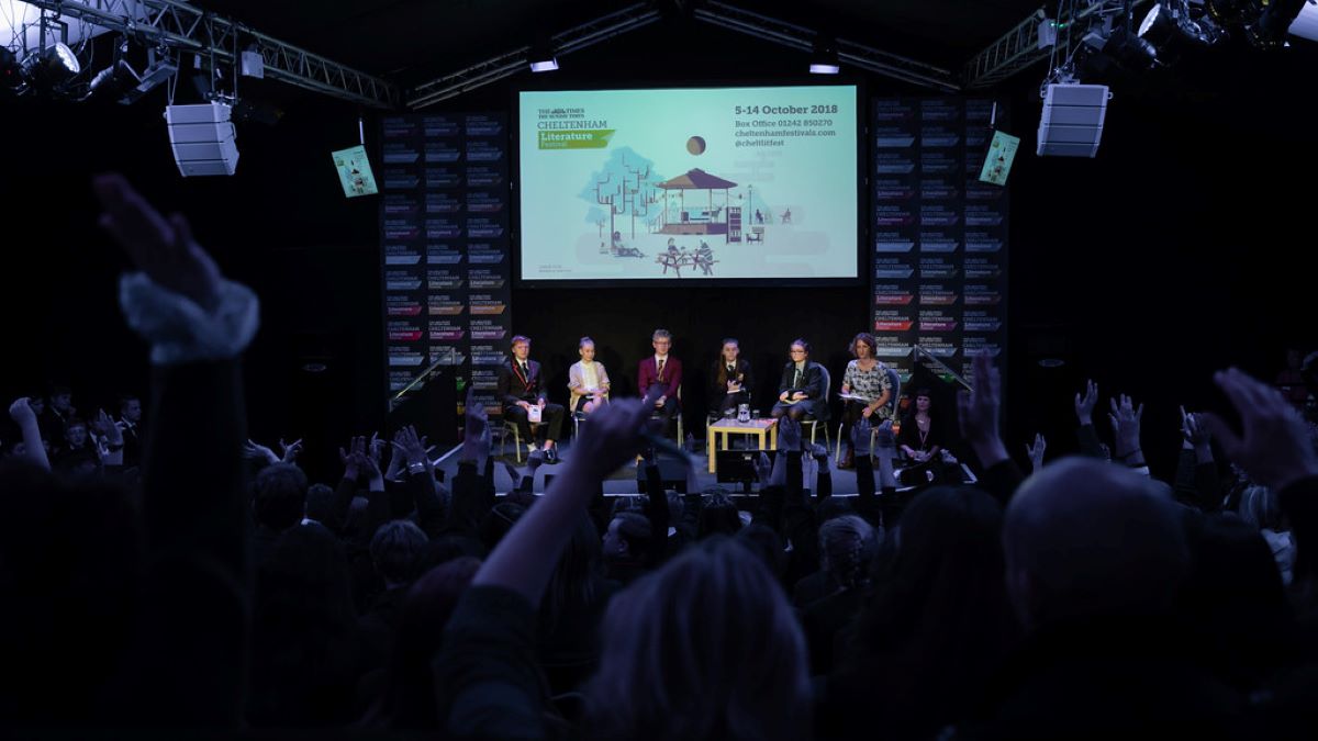 Panel of speakers on stage at Cheltenham Literature Festival